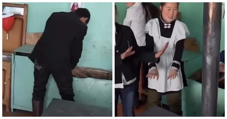 Школьник в Монголии топит печь перед уроками, чтобы класс не замерз Монголия, школа, печь, традиции, учеба, дети, быт